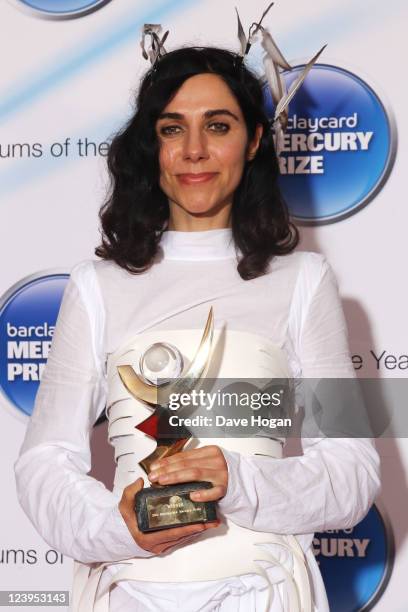 Harvey poses in front of the winners board at the Barclaycard Mercury Prize 2011 at Grosvenor House on September 6, 2011 in London, United Kingdom.