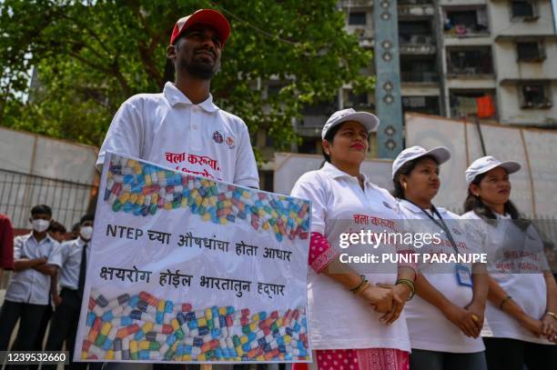 In this picture taken on March 23 health workers take part in a street play to raise awareness on the tuberculosis disease, at a school in Dharavi...