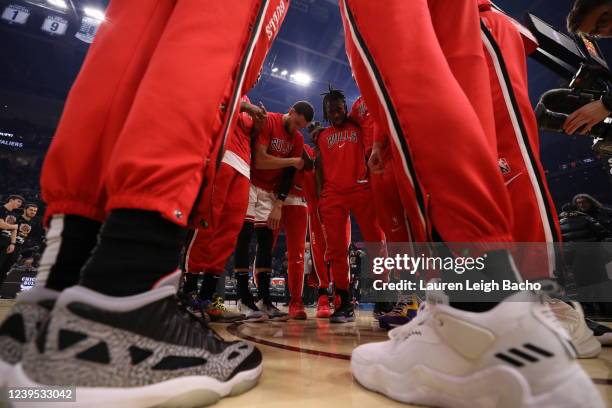 The Chicago Bulls players huddle up before the game against the Cleveland Cavaliers on March 25, 2022 at Rocket Mortgage FieldHouse in Cleveland,...