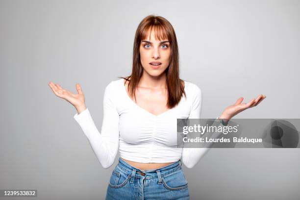 portrait pretty girl surprised with white background - spain teen face imagens e fotografias de stock