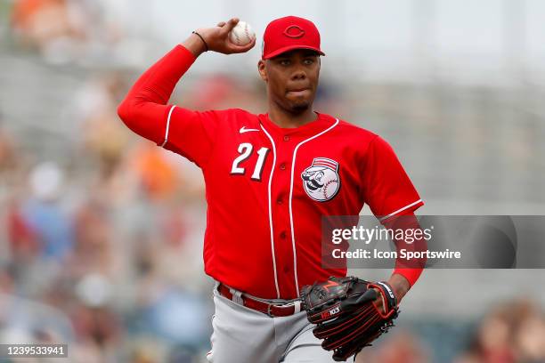 Cincinnati Reds pitcher Hunter Greene throws the ball to first base during a Spring Training Baseball game between the San Francisco Giants and...