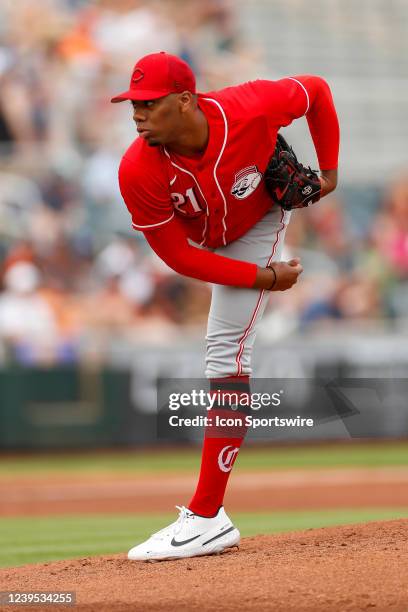 Cincinnati Reds pitcher Hunter Greene pitches the ball during a Spring Training Baseball game between the San Francisco Giants and Cincinnati Reds on...