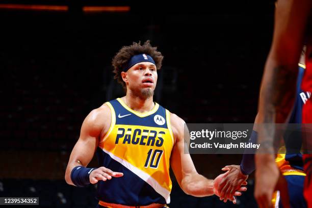 Justin Anderson of the Indiana Pacers high fives a teammate during the game against the Toronto Raptors on March 26, 2022 at the Scotiabank Arena in...