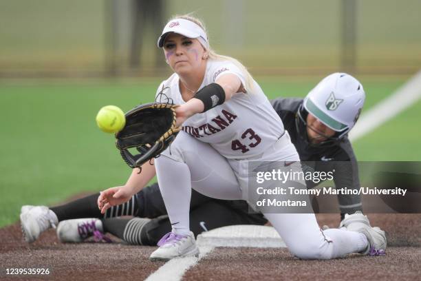 Infielder Kylie Becker of the Montana Grizzlies eyes the ball before a catch during a college softball game against the Portland State Vikings at the...