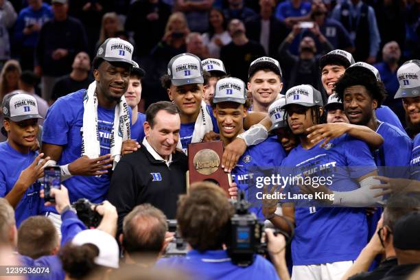 Head coach Mike Krzyzewski of the Duke Blue Devils celebrates with his team followign their victory against the Arkansas Razorbacks during the Elite...