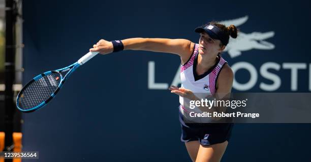 Irina-Camelia Begu of Romania in action against Aliaksandra Sasnovich of Belarus in her third round match on day 6 of the Miami Open at Hard Rock...