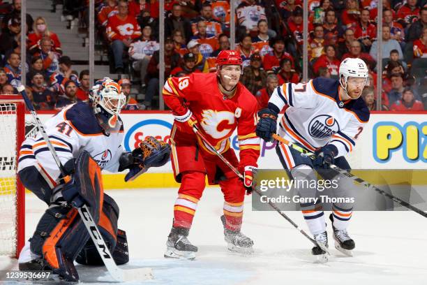 Matthew Tkachuk of the Calgary Flames skates against Brett Kulak of the Edmonton Oilers at Scotiabank Saddledome on March 26, 2022 in Calgary,...