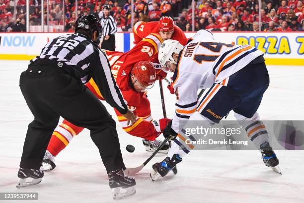 Trevor Lewis of the Calgary Flames faces-off against Devin Shore of the Edmonton Oilers during the third period an NHL game at Scotiabank Saddledome...