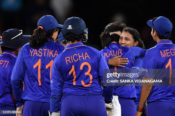 Indian team celebrate the dismissal of South Africa's Laura Wolvaardt during the Women's Cricket World Cup match between South Africa and India at...