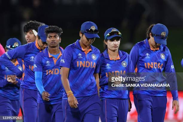Indian team walk off the field after their loss during the Women's Cricket World Cup match between South Africa and India at Hagley Oval in...