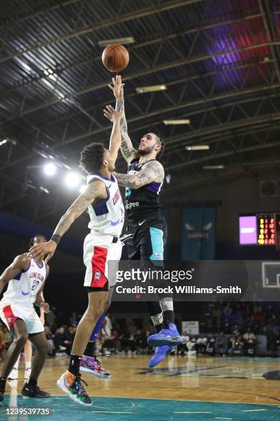 LiAngelo Ball of the Greensboro Swarm drives to the basket during the game against Long Island Nets on March 26, 2022 at Greensboro Coliseum in...