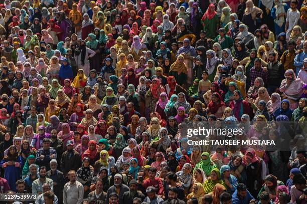 Villagers and relatives mourn during the funeral of a slain policemen and his brother at Chattabugh village of central Kashmirs Budgam district near...