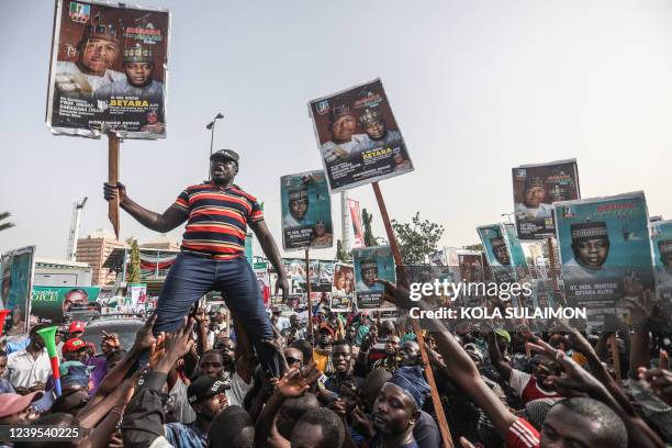 Crowd of the Nigerias ruling political party supporters, the All Progressive Congress, gather outside the partys National Convention, in Abuja,...