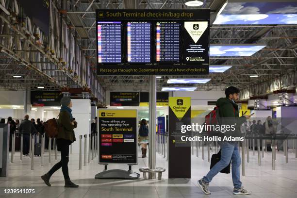 Travelers at Gatwick Airport on March 27, 2022 in London, England. Gatwick's South terminal closed in June 2020 to reduce costs during the Coronvirus...