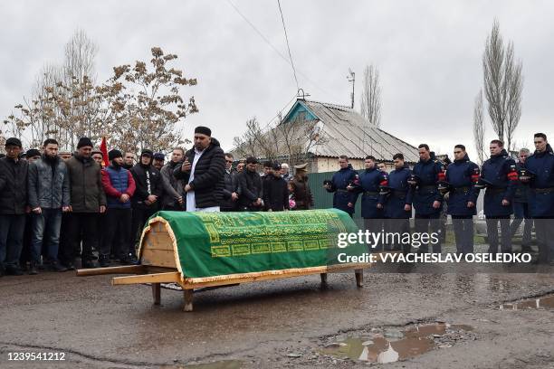 Relatives and honor guards attend a funeral of Rustam Zarifulin who died of wounds on March 14 during the outgoing Russian military action in Ukraine...