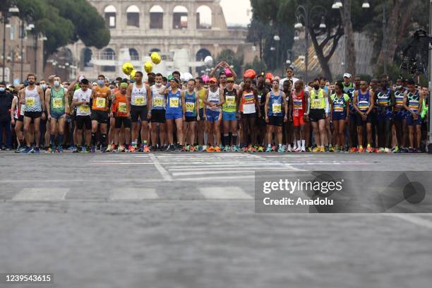 Participants are seen at the Colosseum as they prepare for the start of the 27th edition of the Rome's Marathon, Italy, on March 27, 2022.