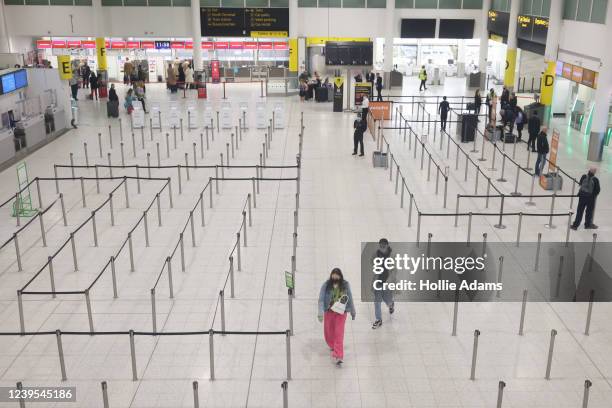 Travelers at Gatwick Airport on March 27, 2022 in London, England. Gatwick's South terminal closed in June 2020 to reduce costs during the Coronvirus...