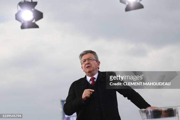 "La France Insoumise" party presidential candidate Jean-Luc Melenchon gestures as he delivers a speech during his meeting in Marseille, southern...