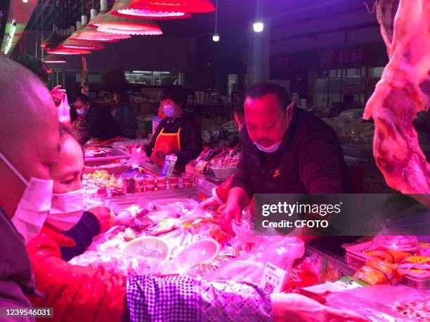 Citizens buy daily necessities at a supermarket in Shanghai, China, on the evening of March 27, 2022.