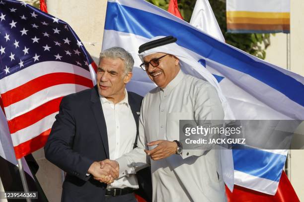 Israels Foreign Minister Yair Lapid welcomes Bahrain's Minister of Foreign Affairs Abdullatif bin Rashid al-Zayani upon his arrival for the Negev...