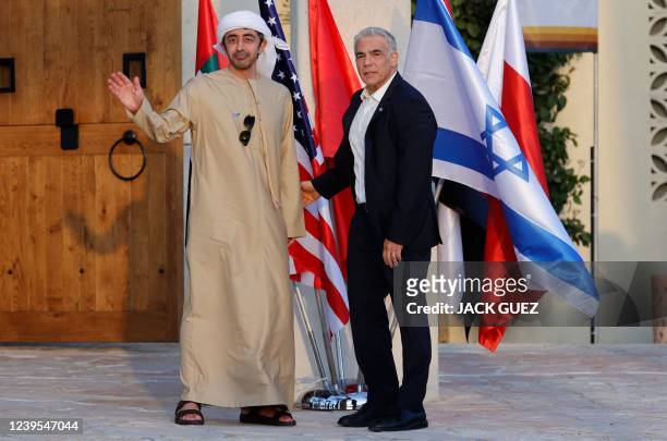 Israels Foreign Minister Yair Lapid welcomes the United Arab Emirates' Foreign Minister Sheikh Abdullah bin Zayed al-Nahyan upon his arrival for the...