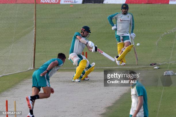Australia's Travis Head plays a shot during a practice session at the Gaddafi Cricket Stadium in Lahore on March 27 ahead of their first one-day...