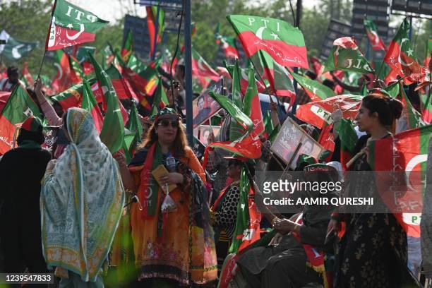 Supporters of ruling Pakistan Tehreek-e-Insaf party attend a rally being addressed by Pakistan's Prime Minister Imran Khan, in Islamabad on March 27,...