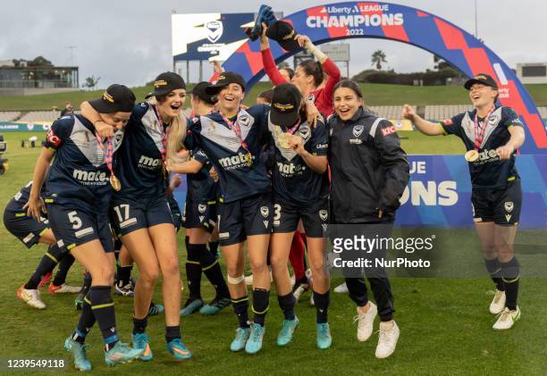 Melbourne Victory players celebrate during the presentation ceremony after winning the A-League Womens Grand Final match between Sydney FC and...