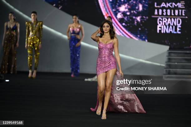 Bollywood actor Ananya Panday presents a creation by designer Falguni Shane Peacock during the grand finale of the FDCI x Lakme Fashion Week, in New...