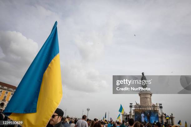 An Ukrainian flag is seen in Praca do Comercio, in Lisbon, Portugal during a demonstration to show solidarity with the people of that country...