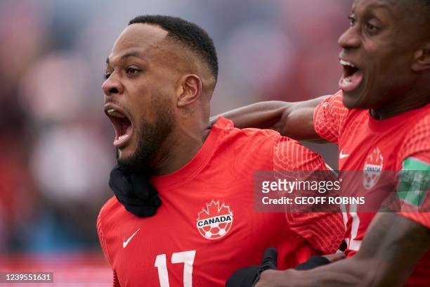 Canadas Cyle Larin celebrates his goal with teammate Richie Laryea during their World Cup Qualifying match against Jamaica at BMO Field in Toronto,...