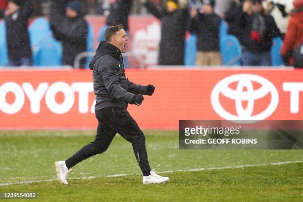 Canadas mens soccer coach John Herdman celebrates after his team defeated Jamaica 4-0 in their World Cup Qualifying match at BMO Field in Toronto,...