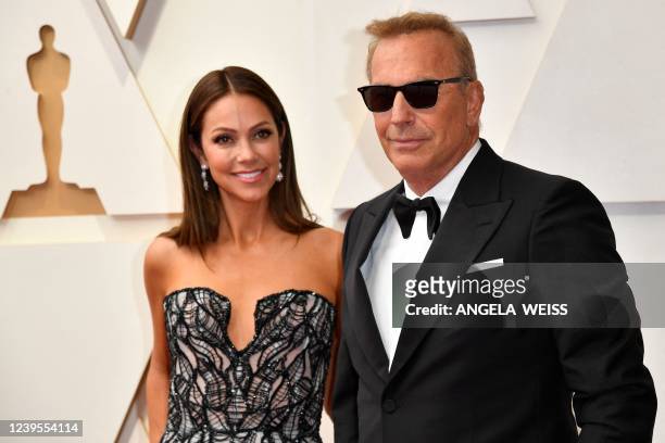 Actor Kevin Costner and his wife Christine Baumgartner attend the 94th Oscars at the Dolby Theatre in Hollywood, California on March 27, 2022.
