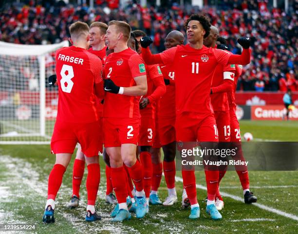 Canada players Liam Fraser, Alistair Johnson, Tajon Buchanan and teammates celebrate a goal by Junior Hoilett during a 2022 World Cup Qualifying...