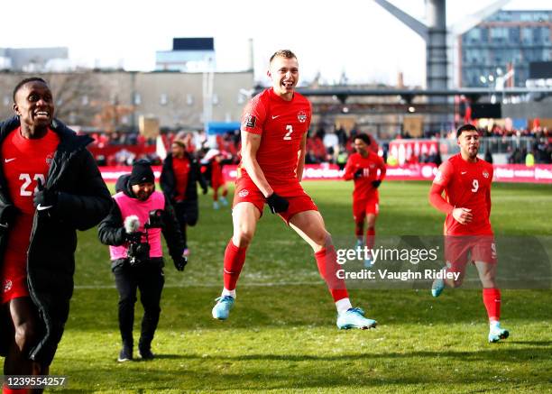 Alistair Johnston of Canada celebrates after the final whistle following a 2022 World Cup Qualifying match against Jamaica at BMO Field on March 27,...