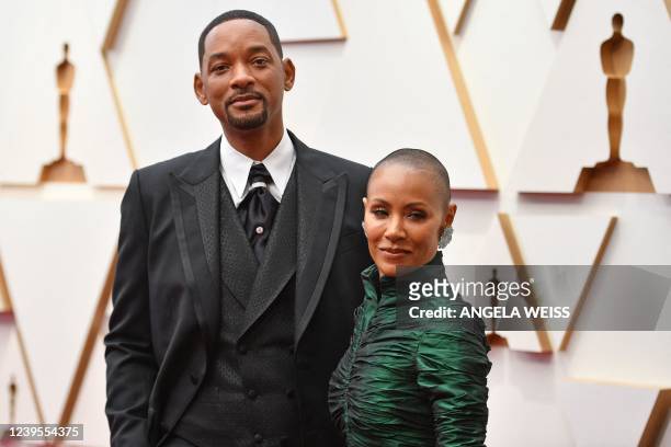 Actor Will Smith and Jada Pinkett Smithattend the 94th Oscars at the Dolby Theatre in Hollywood, California on March 27, 2022. / The erroneous...