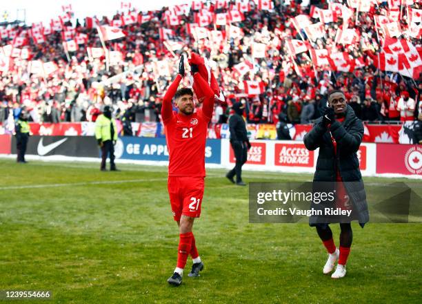 Jonathan Osorio and Richie Laryea of Canada celebrate after the final whistle following a 2022 World Cup Qualifying match against Jamaica at BMO...