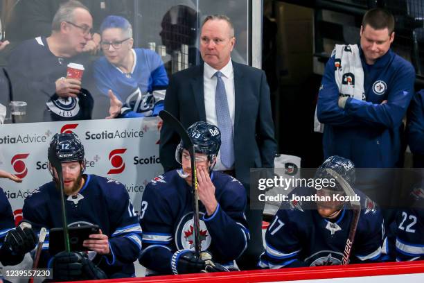 Interim Head Coach Dave Lowry of the Winnipeg Jets looks on from the bench during first period action against the Arizona Coyotes at the Canada Life...