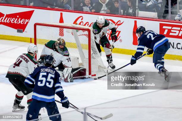 Nikolaj Ehlers of the Winnipeg Jets attempts a wrap-around goal as goaltender Karel Vejmelka of the Arizona Coyotes guards the net during second...