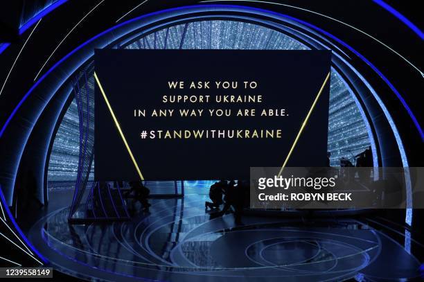 Message in support of Ukraine is displayed on a screen onstage during the 94th Oscars at the Dolby Theatre in Hollywood, California on March 27, 2022.