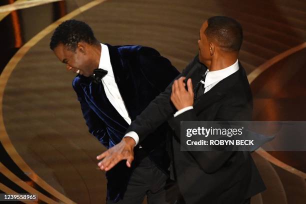 Actor Will Smith slaps US actor Chris Rock onstage during the 94th Oscars at the Dolby Theatre in Hollywood, California on March 27, 2022.