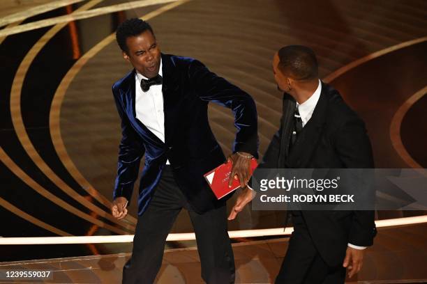 Actor Will Smith slaps US actor Chris Rock onstage during the 94th Oscars at the Dolby Theatre in Hollywood, California on March 27, 2022.