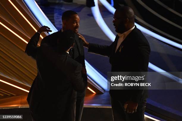 Actor Denzel Washington , US actor Will Smith and US actor-producer Tyler Perry chat during the 94th Oscars at the Dolby Theatre in Hollywood,...