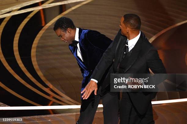 Actor Will Smith slaps US actor Chris Rock onstage during the 94th Oscars at the Dolby Theatre in Hollywood, California on March 27, 2022.