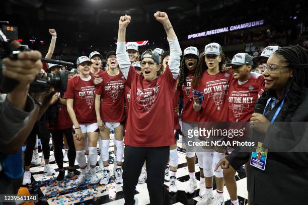 Head coach Tara VanDerveer of the Stanford Cardinal and players celebrate after beating the Texas Longhorns 59-50 during the Elite 8 round of the...