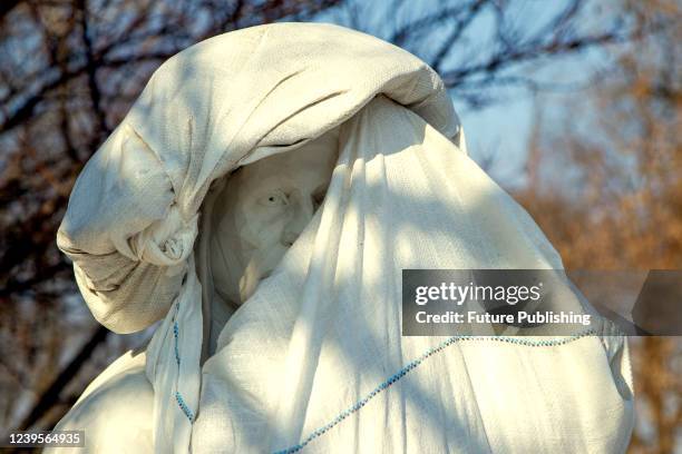 Sandbags surround the monument to Italian poet, writer and philosopher Dante Alighieri to protect the statue from possible Russian shelling in...