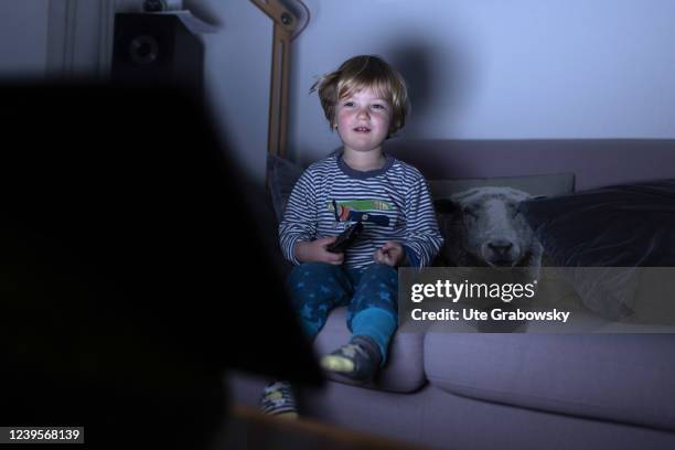 In this photo illustration a child is sitting in front of a screen on March 20, 2022 in Bonn, Germany.