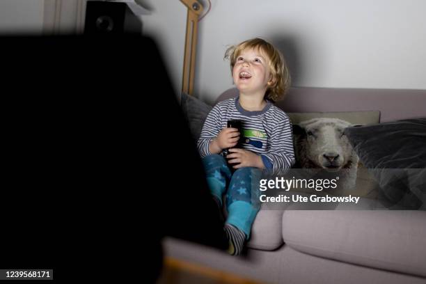 In this photo illustration a toddler, child is havong fun in front of a screen on March 20, 2022 in Bonn, Germany.