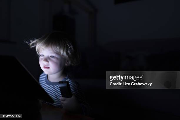 In this photo illustration a child is having a blueface from a screen on March 20, 2022 in Bonn, Germany.