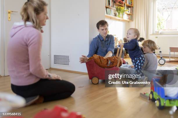 In this photo illustration Family with two toddlers in their living room on March 20, 2022 in Bonn, Germany.